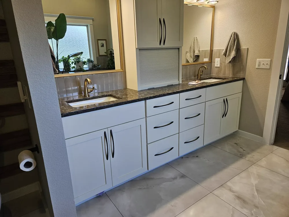 Large-format tile flooring installed in a remodeled Salina, Kansas bathroom by Salina Appliance and Flooring